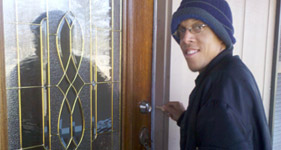 man opening front door with key