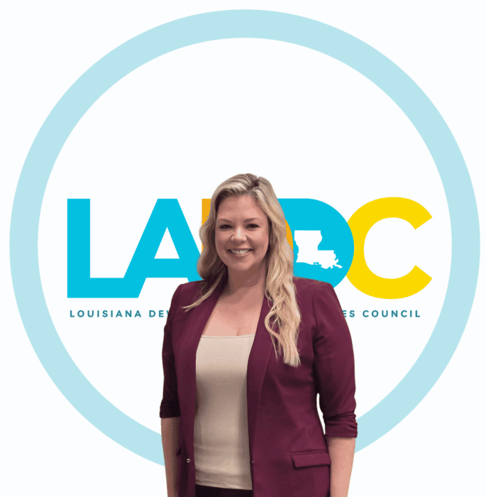 Woman with long, wavy blonde hair smiling, representing support for Louisiana citizens with developmental disabilities.